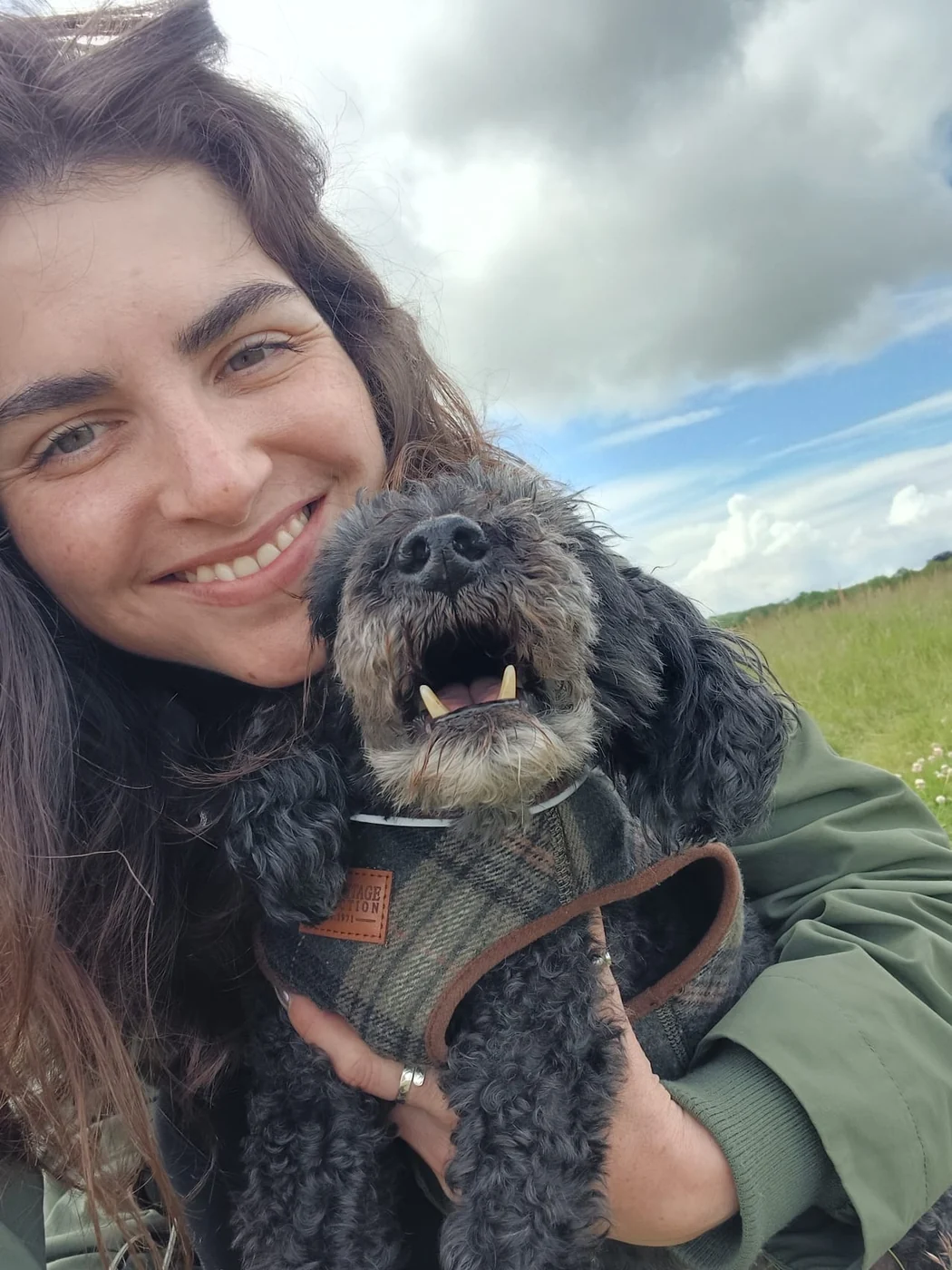 Olivia from Whispering Walks with a dog outdoors